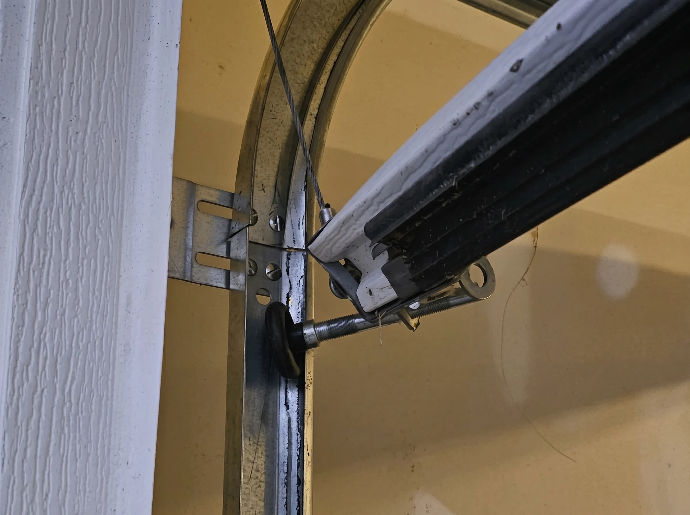 Garage door rollers in the track